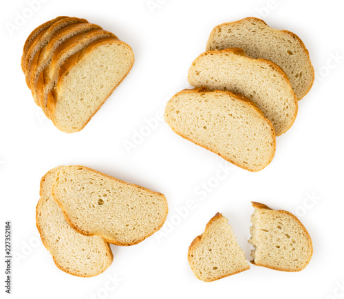 Sliced loaf of white bread lies in different combinations on a white. The view from the top.