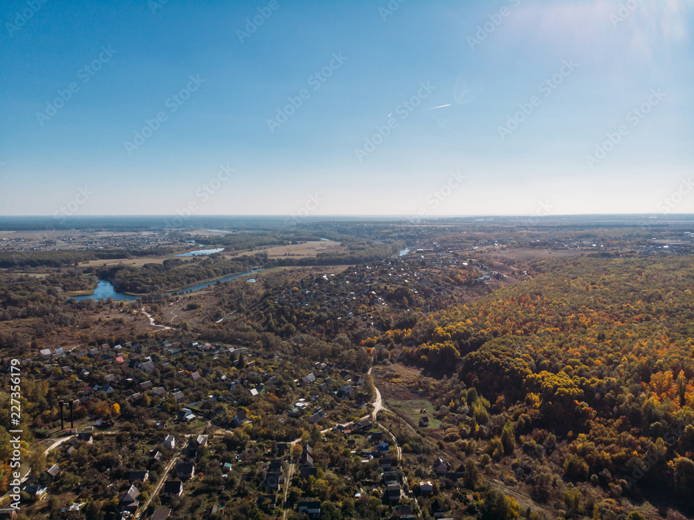 Aerial or top view of rural village in beautiful autumn nature landscape panorama