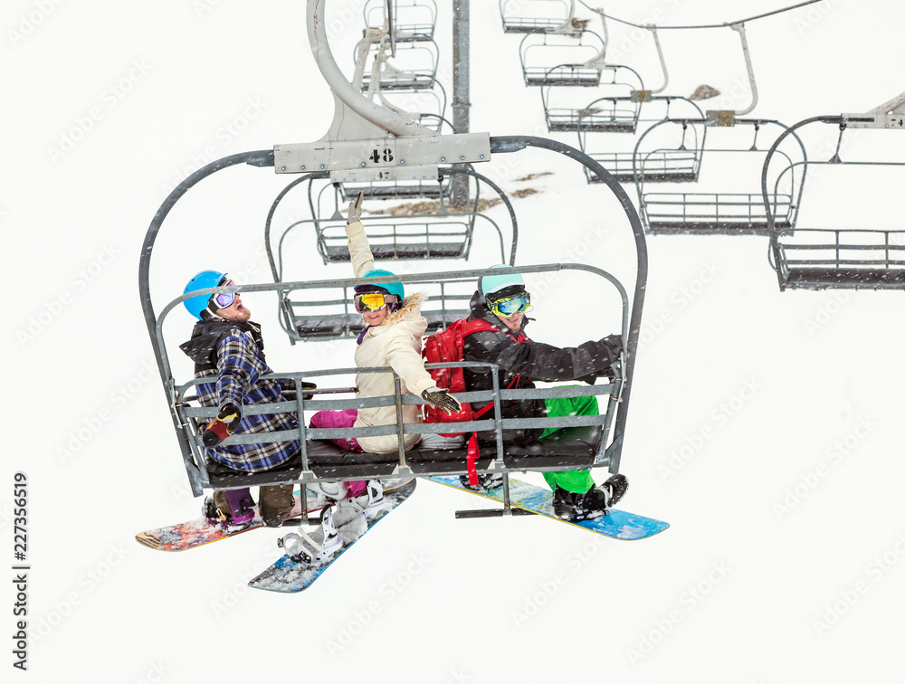 Three friends of snowboarders in mountains Three friends of snowboarders in mountains