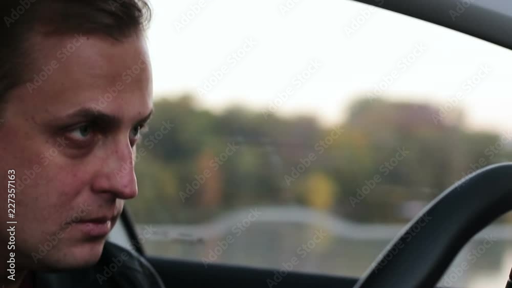 Tired or drunk driver falling asleep at the wheel. Dangerous driving