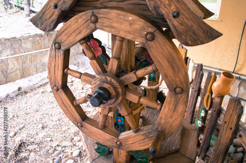 Wooden lever-wheel to lift the bucket from the well.