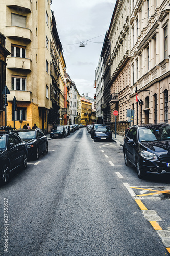 Street with cars and old buildings in the historical district of Budapest city  Hungary