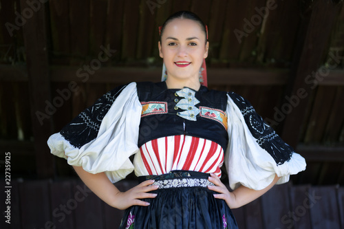 Young beautiful slovak woman in traditional costume. Slovak folklore.