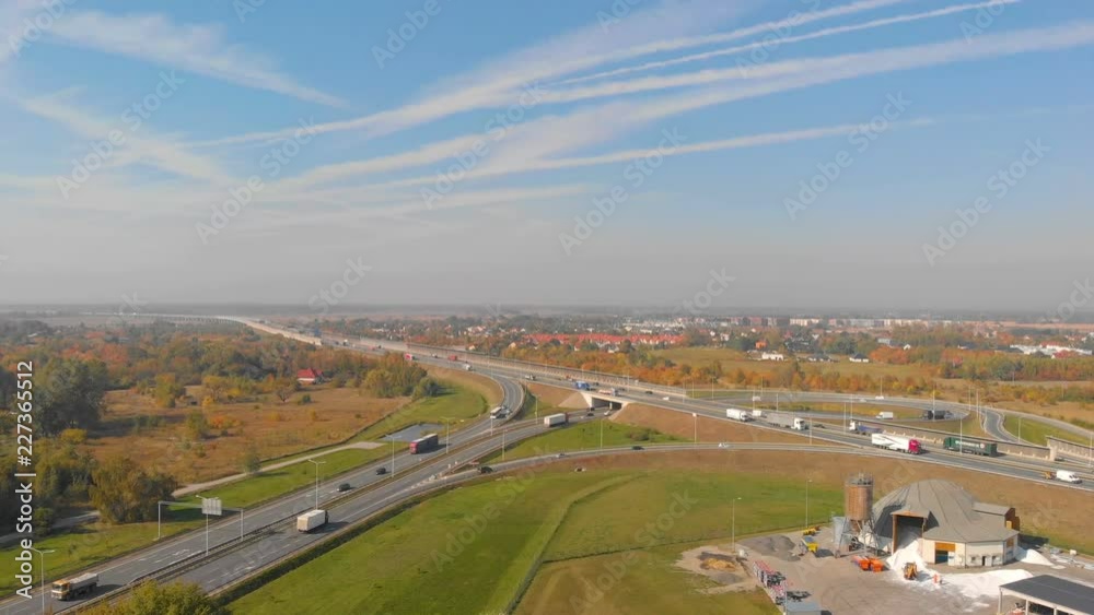 highway road interchange with busy traffic (aerial view) highway road interchange with busy traffic (aerial view)