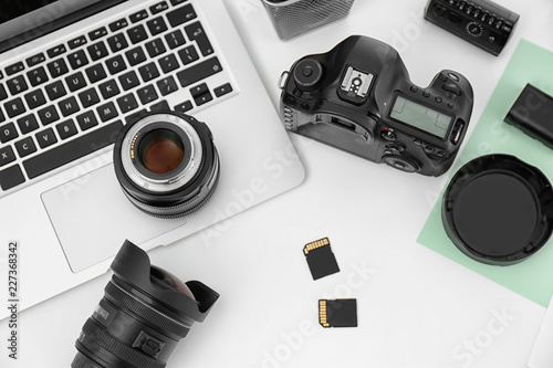 Composition with equipment for professional photographer on white background