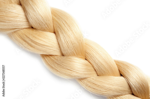 Healthy braided blond hair isolated on white