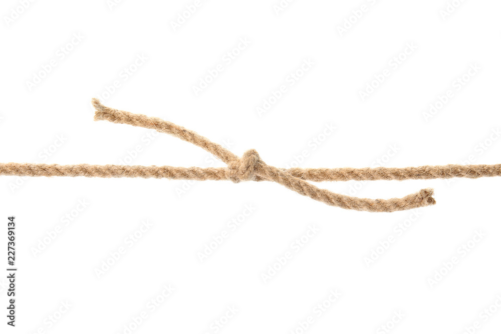 Hemp rope with knot on white background. Organic material