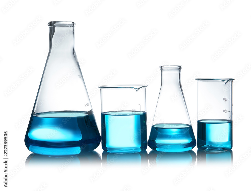 Laboratory glassware with liquid on table against white background. Chemical analysis Laboratory glassware with liquid on table against white background. Chemical analysis