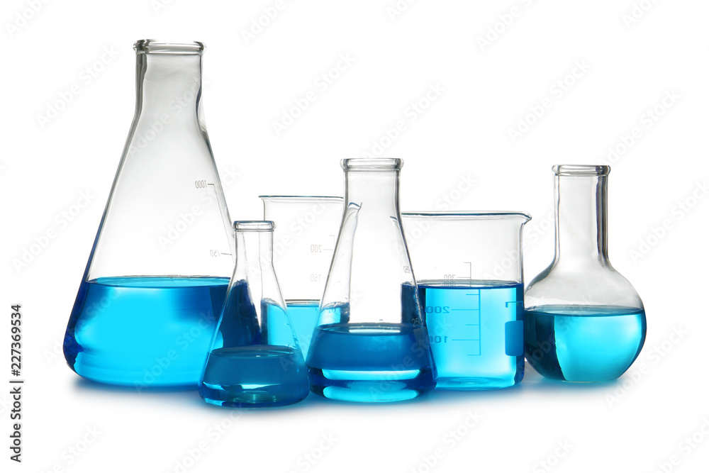 Laboratory glassware with liquid on table against white background. Chemical analysis Laboratory glassware with liquid on table against white background. Chemical analysis
