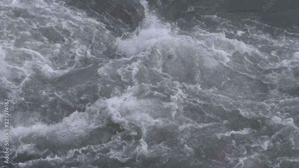 City river with rapids. Strong current. Summer day City river with rapids. Strong current. Summer day