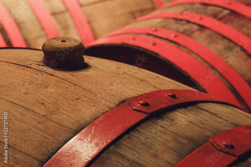 Vineyard cellar./ Wooden barrels traditional form of storage in the alcohol industry