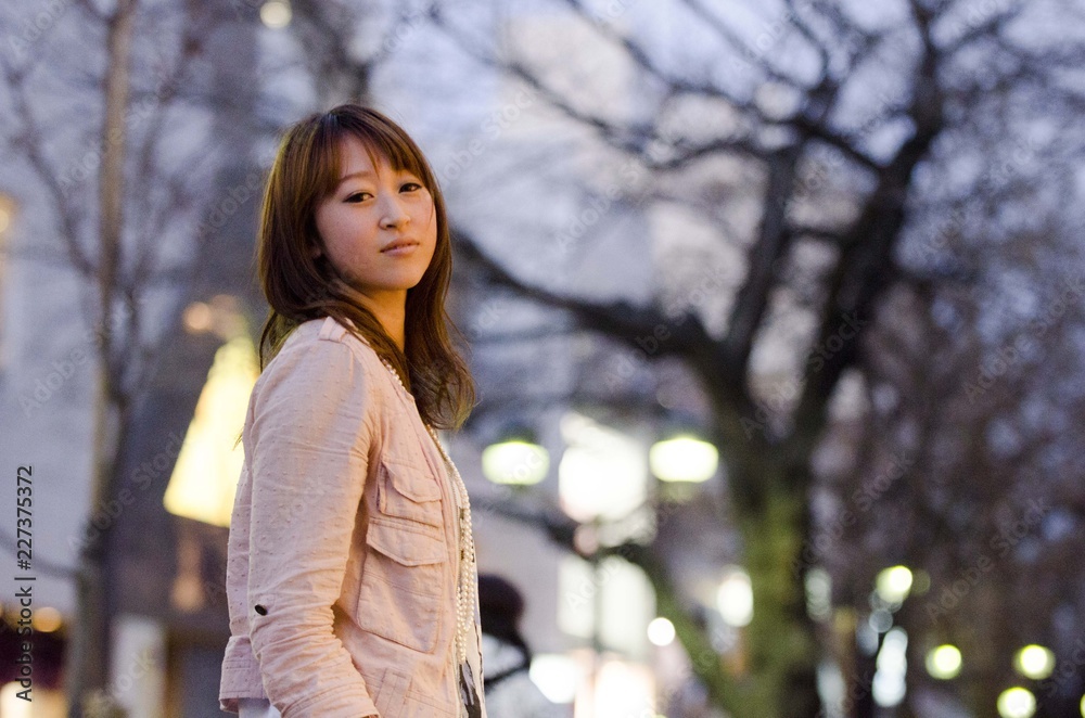 Japanese Girl poses on the street in Jiyugaoka, Japan. Jiyugaoka is a town located in Tokyo. Japanese Girl poses on the street in Jiyugaoka, Japan. Jiyugaoka is a town located in Tokyo.