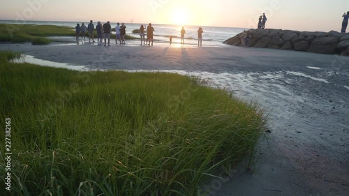 Panning shot of beach at sunset in Cape Cod, Massachusetts photo