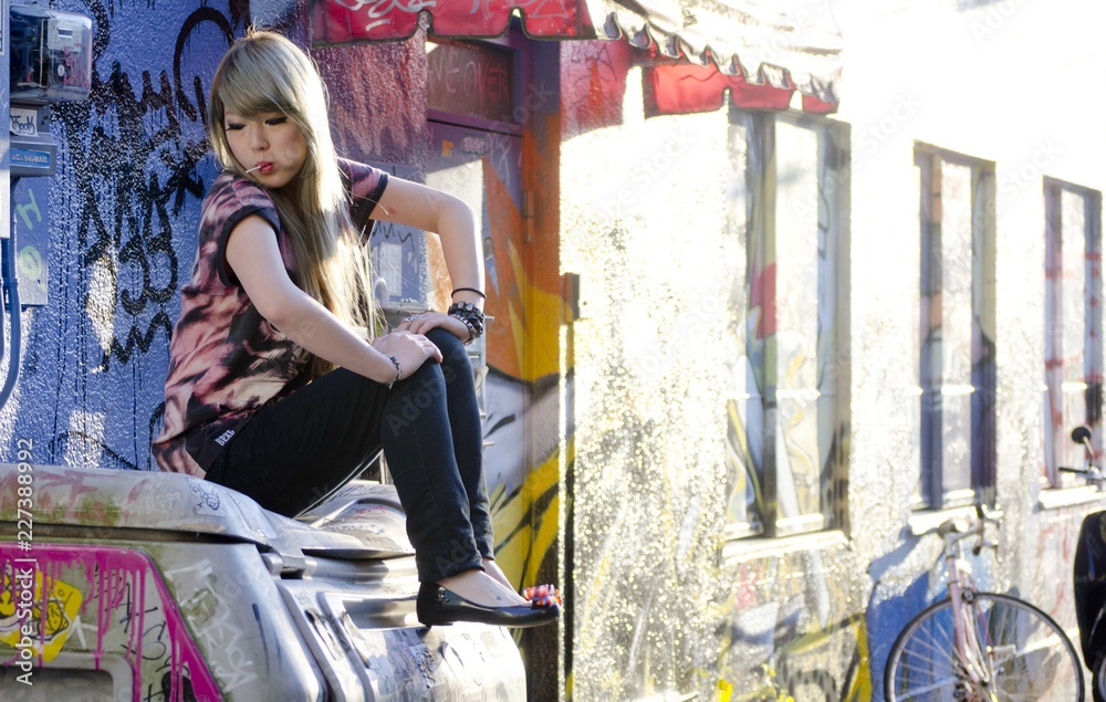 Japanese Girl poses on the street in Shibuya, Japan. Shibuya is a town ...