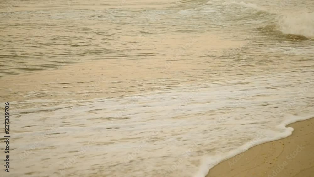 Yellow sand and clear water sea ocean beach in the morning in the evening. Sea landscape scenery country scene background. Natural ocean backdrop summer concept. Beige Tone Yellow sand and clear water sea ocean beach in the morning in the evening. Sea landscape scenery country scene background. Natural ocean backdrop summer concept. Beige Tone