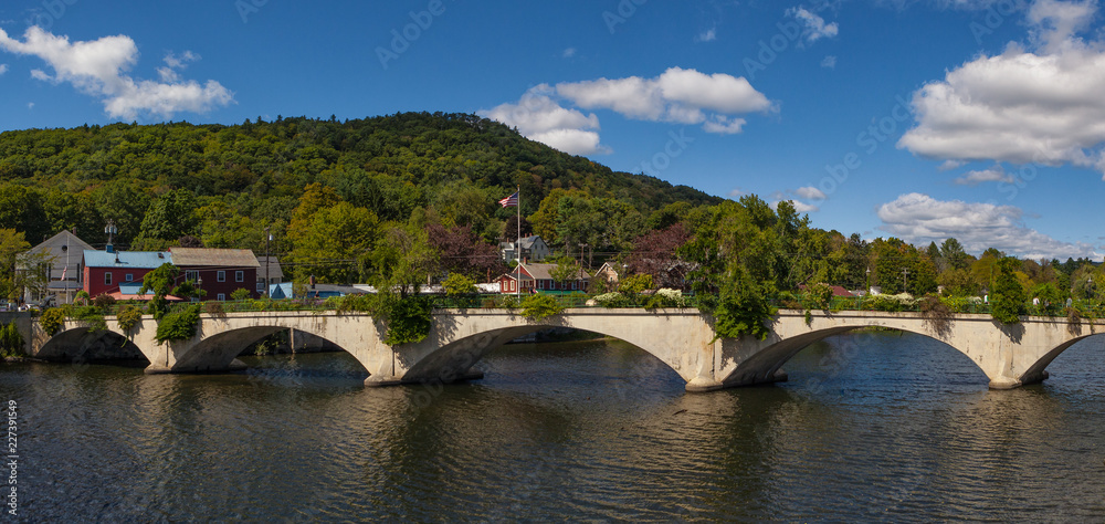 Fototapeta premium Trolly bridge over the river with blue sky