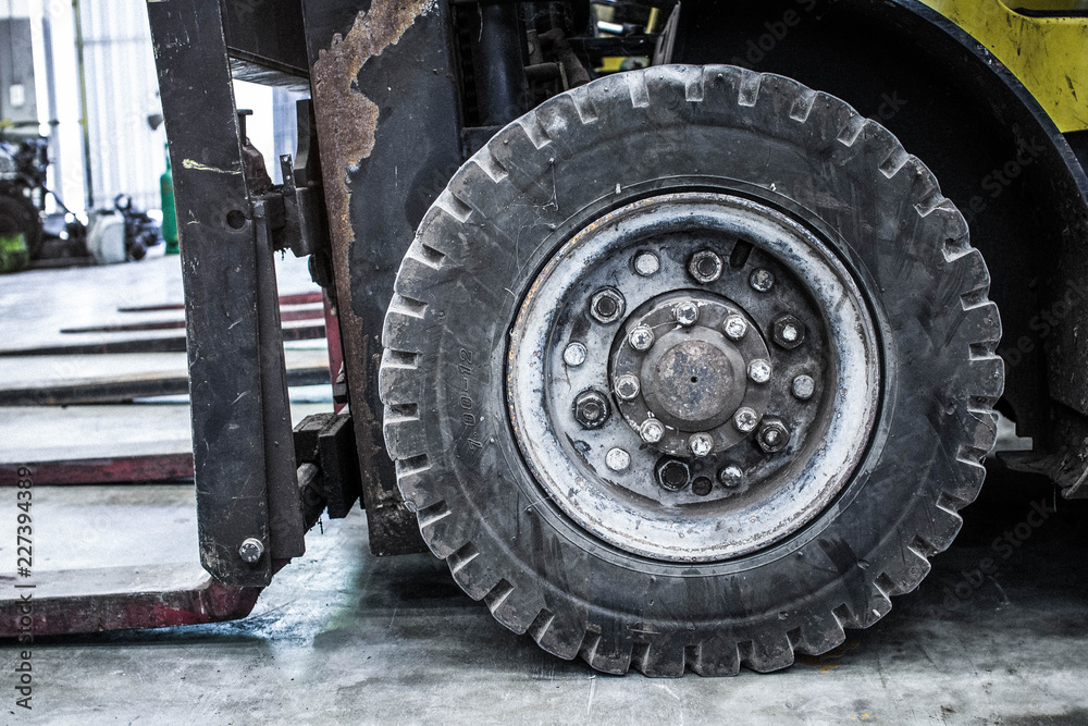 The front wheels of the forklift. The front wheels of the forklift.