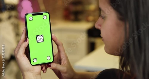 Woman using green screen phone