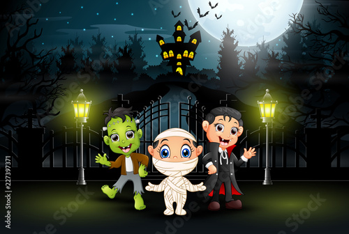 Fotografie Happy kids wearing halloween costume outdoors at night