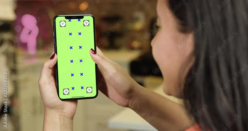 Woman using green screen phone