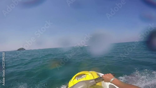 Video in first person going fast on a jet ski in Thailand Phuket on a sunny day. Vacation living life. 60FPS. Clip 6 photo