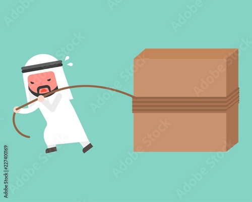 Arab Businessman work hard, pulling block with rope