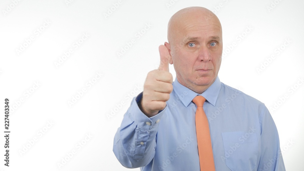 Confident Businessman Make Thumbs Up a Serious Good Job Sign Confident Businessman Make Thumbs Up a Serious Good Job Sign