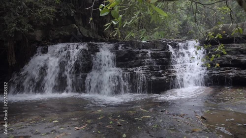 Moving forward shot of Batu Hampar Waterfall at Maran, Malaysia photo