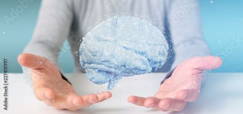 Businessman holding a 3d rendering artificial brain