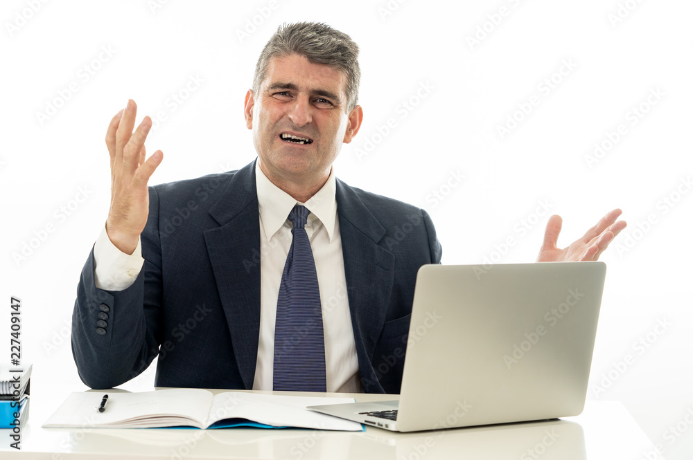 Angry and frustrated businessman with laptop shouting and worrying Angry and frustrated businessman with laptop shouting and worrying