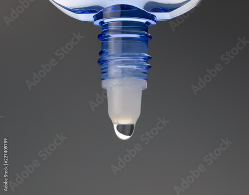 Eyedrop in blue transparent container.