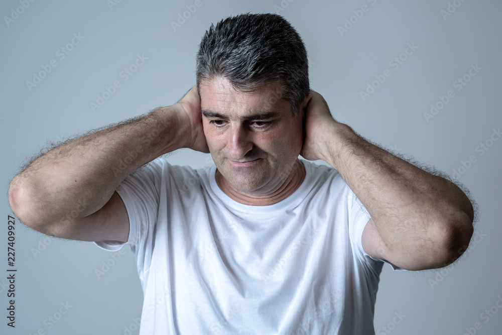 Sad and desperate mature handsome man feeling depressed in Facial expressions and depression Sad and desperate mature handsome man feeling depressed in Facial expressions and depression