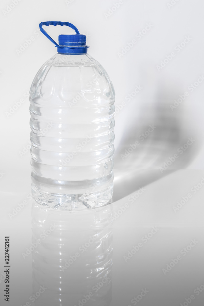 Five-liter plastic bottle with clean water.