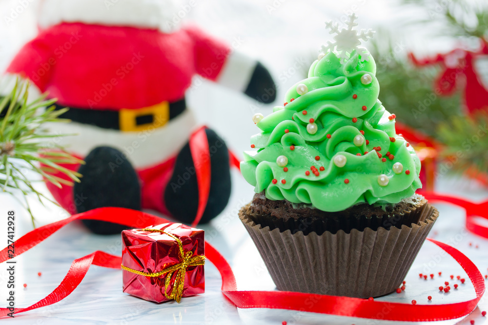 Christmas tree cupcake with green cream frosting, beautiful chocolate cake shaped fairy Christmas tree Christmas tree cupcake with green cream frosting, beautiful chocolate cake shaped fairy Christmas tree