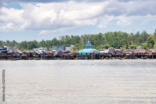 water village along a river in borneo island