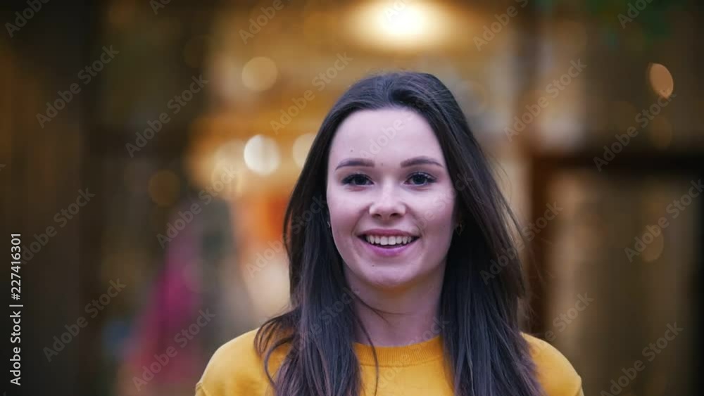 Happy woman portrait. Autumn in slow motion, smiling. Happy woman portrait. Autumn in slow motion, smiling.