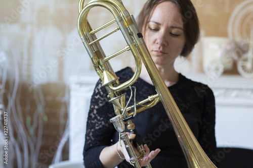 Portrait of a young woman trombonist photo