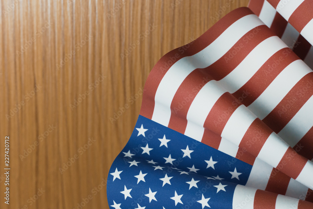 Obraz premium The Veterans Day concept united states of America flag on wood background.