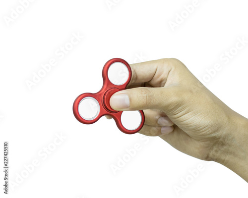 Hand holding fidget spinner isolated on white background. Stress relieving toy. photo