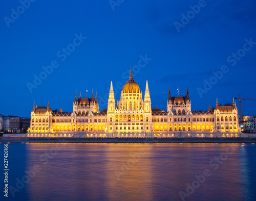 travel and european tourism concept. Budapest, Hungary. Hungarian Parliament Building over Danube River illuminated at night. © Melinda Nagy