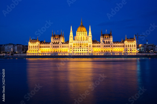 travel and european tourism concept. Budapest, Hungary. Hungarian Parliament Building over Danube River illuminated at night. © Melinda Nagy
