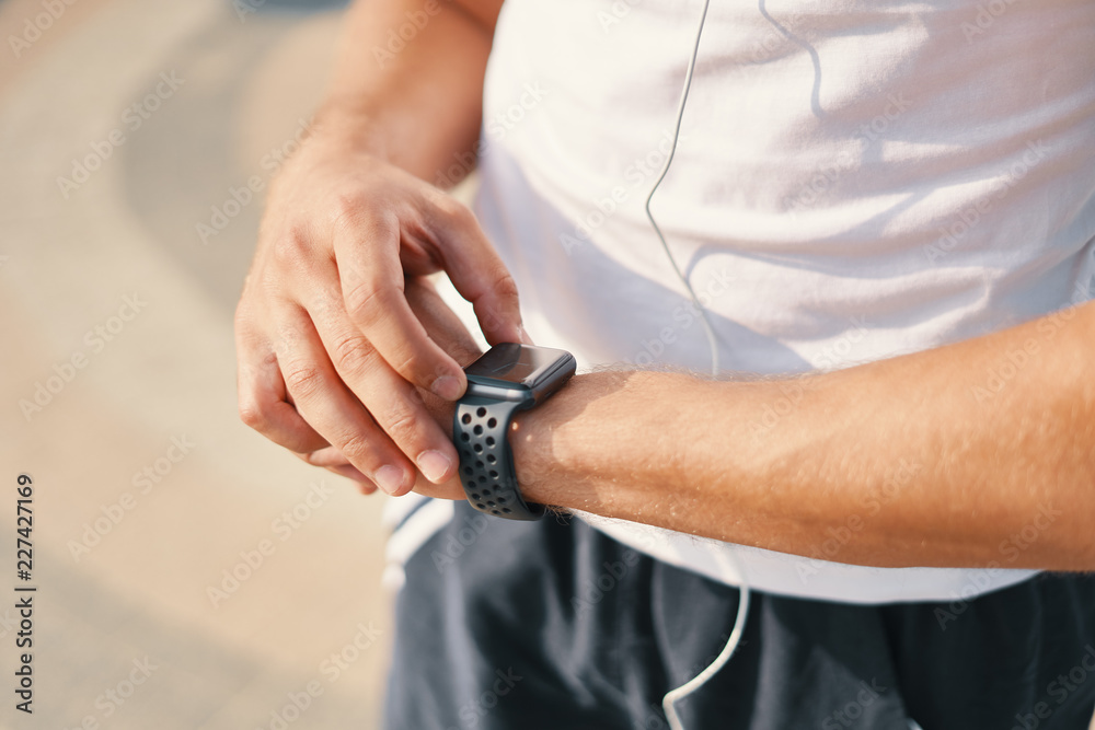 Person using smart watch close-up hands