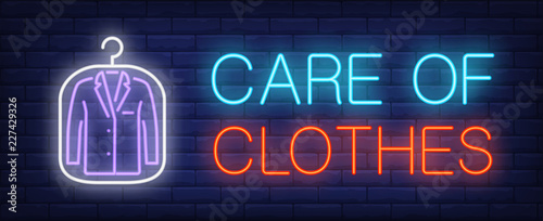 Care of clothes neon sign. Coat in plastic bag. Dry cleaning, laundry, dressmaking. Night bright advertisement. Vector illustration in neon style for service, business, fashion