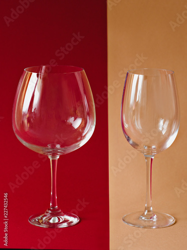 wine glasses on the paper beige and burgundy colors lines background