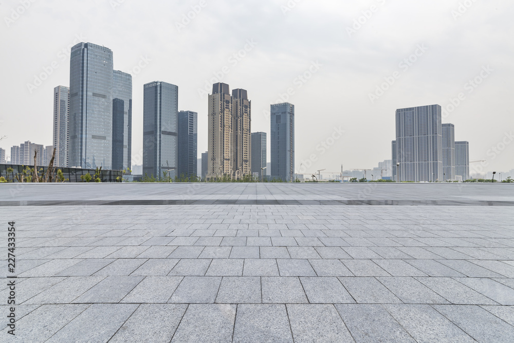 Panoramic skyline and modern business office buildings with empty road,empty concrete square floor