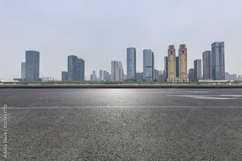 Panoramic skyline and modern business office buildings with empty road,empty concrete square floor