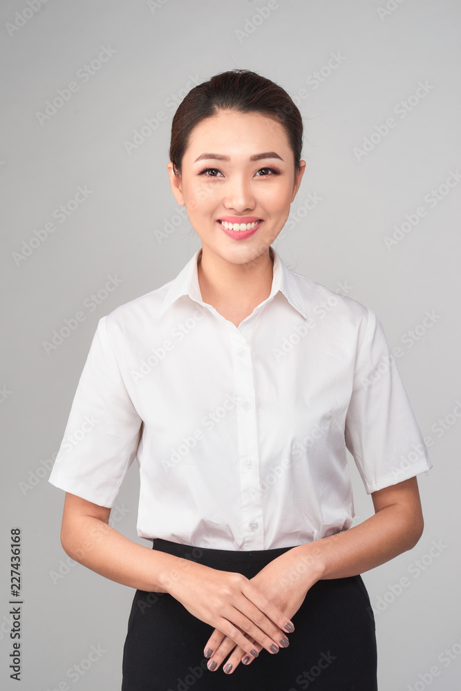 Formal Asian Business woman on gray background Formal Asian Business woman on gray background