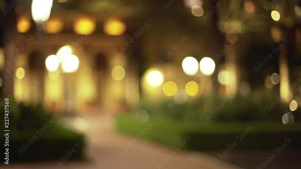 Out of focus background plate of empty walkway in city park
