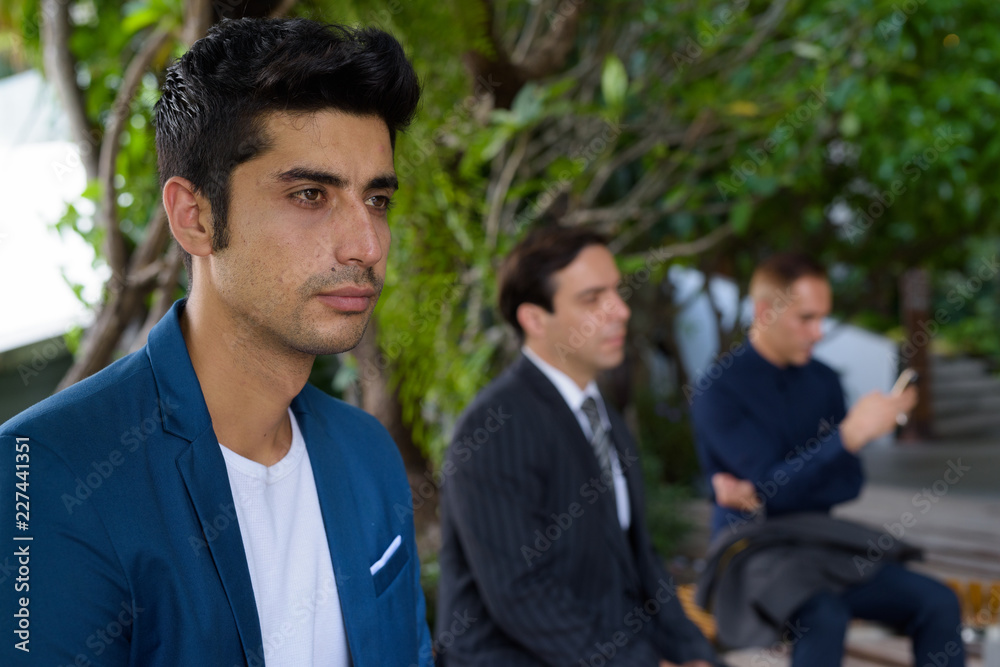 Persian businessmen exploring the city of Bangkok together Persian businessmen exploring the city of Bangkok together
