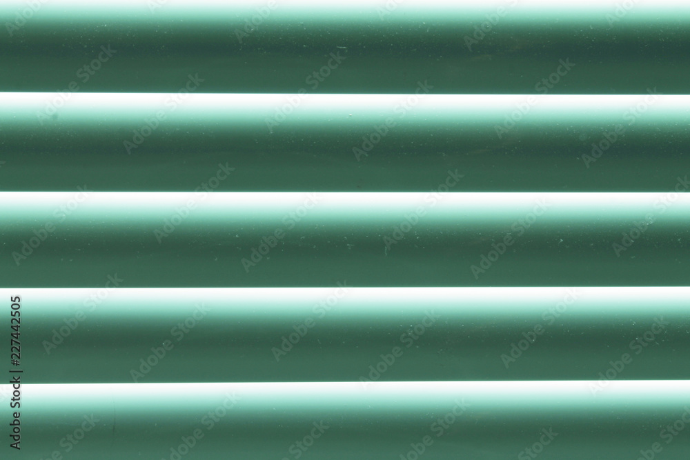 Obraz premium Green blinds. Close-up